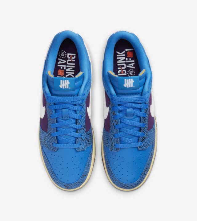 nike dunk x undefeated 5 on it
